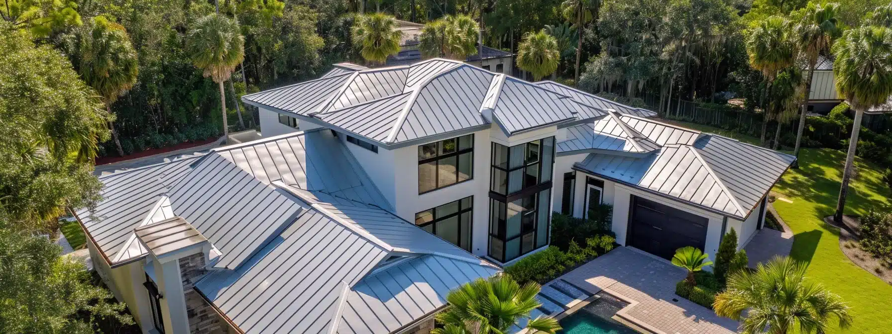 a sleek, silver metal roof glistening in the florida sun, reflecting heat and keeping a home cool and comfortable.