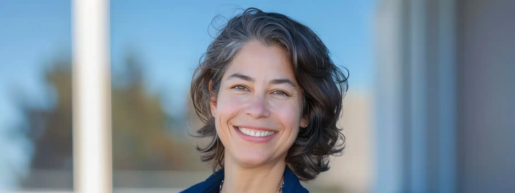 a skilled contractor expertly installing a sleek, durable metal roof under a clear blue sky.