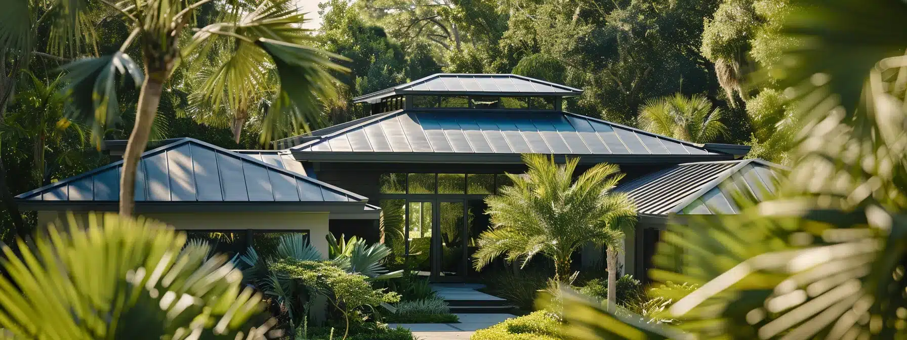 a gleaming metal roof shimmering under the clear florida sun, protected by a fresh coat of sealant and surrounded by neatly trimmed vegetation.